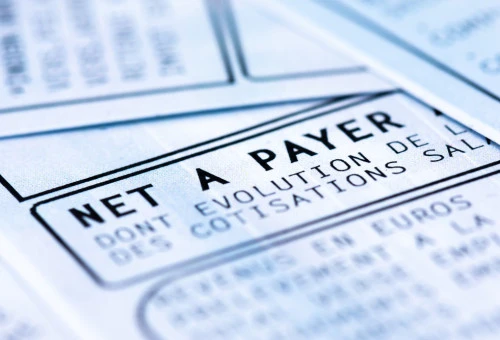 Clamart, France - April 12, 2019: French payroll with income tax deduction. Closeup shot 